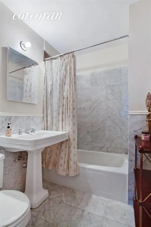 New York City Real Estate | View 101 West 12th Street, 16M | Cararra Marble Bathroom | View 5