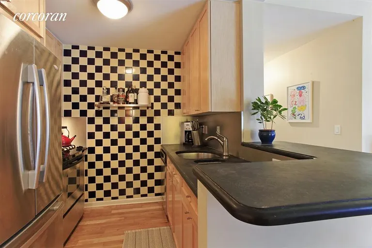 New York City Real Estate | View 240 East 10th Street, 4C | Kitchen with breakfast bar | View 2