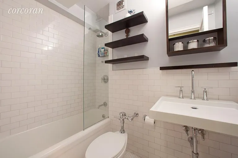 New York City Real Estate | View 200 West 20th Street, 1002 | Brick tile pattern with custom shelving | View 4