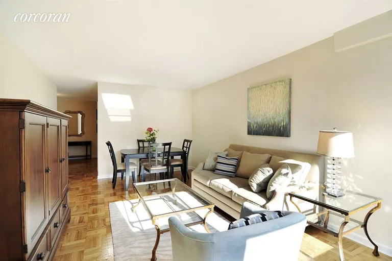 New York City Real Estate | View 315 East 65th Street, 8D | Dining Area in Spacious Living Room | View 2