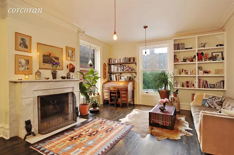 New York City Real Estate | View 321 Clinton Avenue, 10 | Large and open with a wood burning fireplace. | View 2