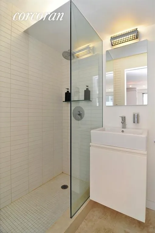 New York City Real Estate | View 209 East 56th Street, 11M | Bathroom With Duravit Fixtures and Rainfall Shower | View 5