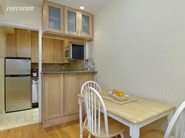 New York City Real Estate | View 30 East 9th Street, 6GG | Dining Area and Open Kitchen | View 3