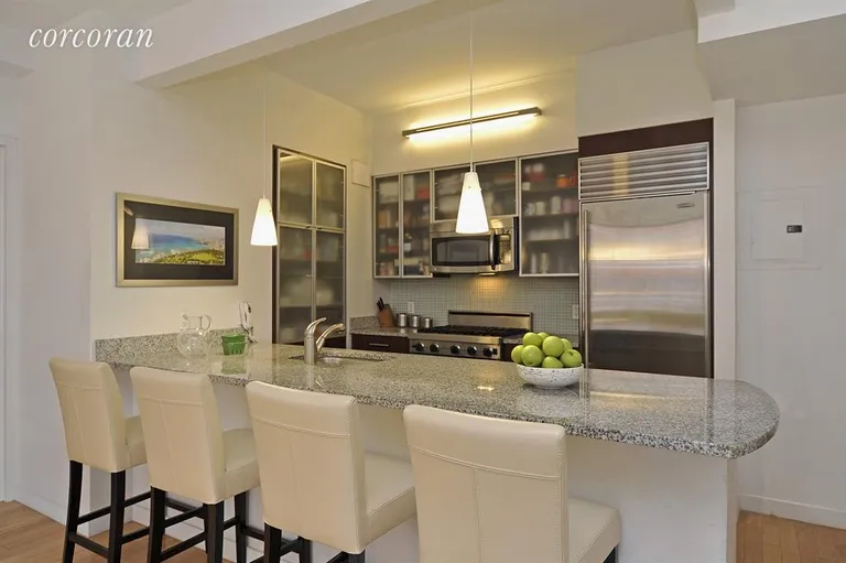 New York City Real Estate | View 555 West 23rd Street, N12J | OPEN CHEF'S KITCHEN WITH OVERSIZED ISLAND | View 2