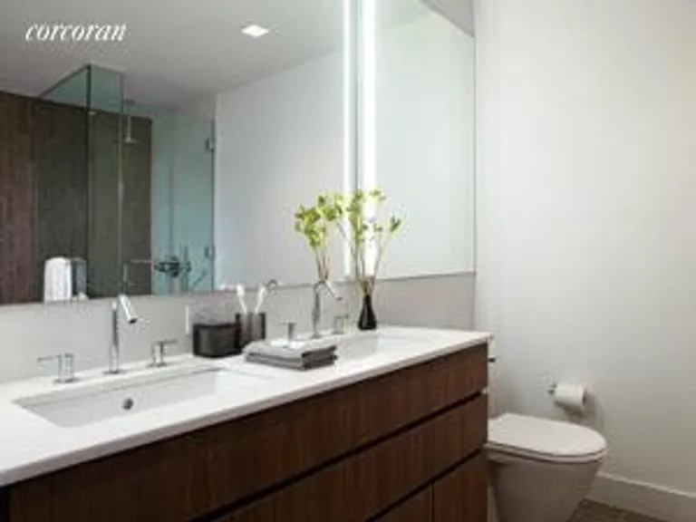 New York City Real Estate | View 447 West 18th Street, 6E | Master Bath with Architect Designed Walnut Vanity | View 3