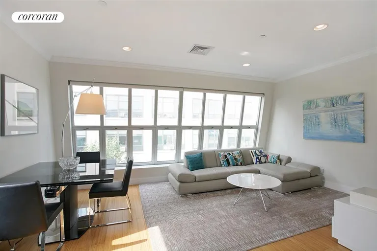 New York City Real Estate | View 185 Huntington Street, 5 | South-facing living room with wall of windows | View 3