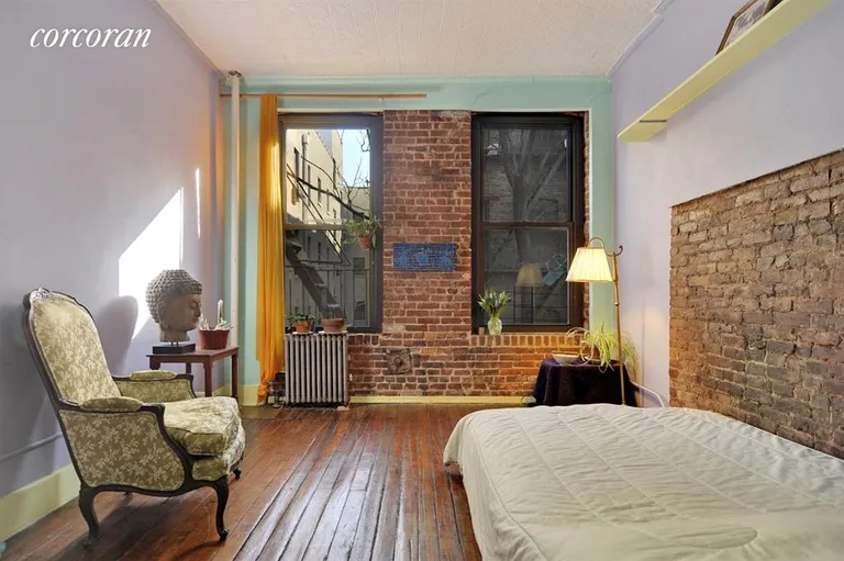 New York City Real Estate | View 71 Sullivan Street, 4C | Living/sleeping room with exposed brick | View 2