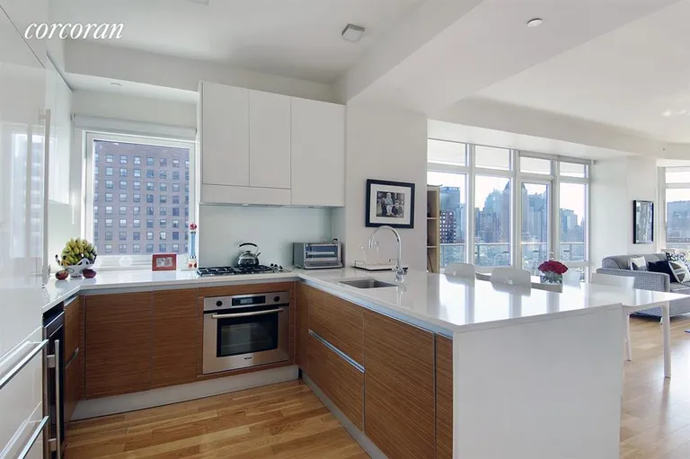 New York City Real Estate | View 555 West 59th Street, 28C | Open designer kitchen with breakfast bar | View 2