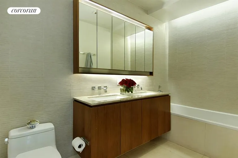 New York City Real Estate | View 555 West 59th Street, 28C | Limestone bath w/ soaking tub and separate shower | View 4