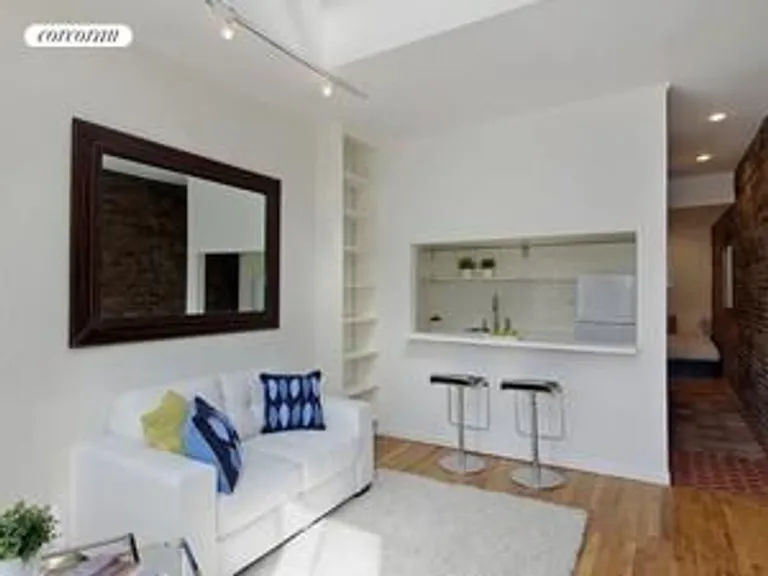 New York City Real Estate | View 221 West 21st Street, 5A | Living Room and Open Kitchen | View 2