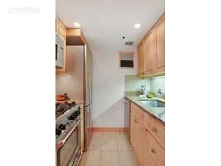 New York City Real Estate | View 67 East 11th Street, 323 | Mint Granite Kitchen w Oak Cabinets | View 4