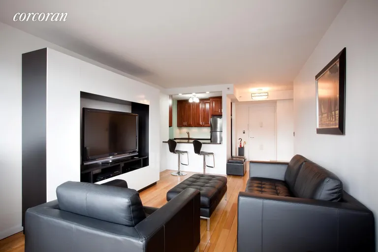 New York City Real Estate | View 4-74 48th Avenue, 7M | Large living room with breakfast bar | View 2