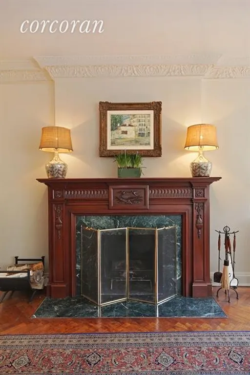 New York City Real Estate | View 1040 Park Avenue, 9HJ | Wood-Burning Fireplace in Living Room | View 3