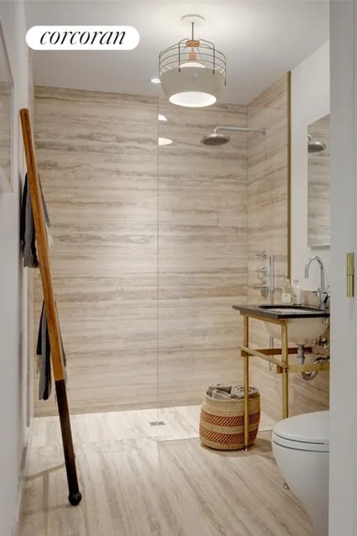 New York City Real Estate | View 345 West 14th Street, 2C | Wet room bath with Spanish Travertine marble | View 3