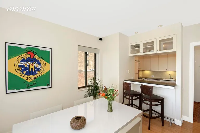 New York City Real Estate | View 77 Bleecker Street, 1205W | Dining room and open kitchen | View 2
