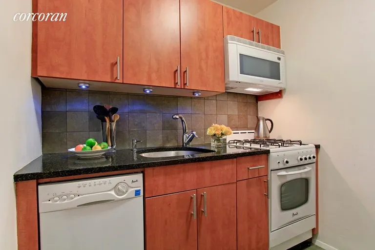 New York City Real Estate | View 67 East 11th Street, 519 | Renovated Kitchen w Custom Cabinets | View 2
