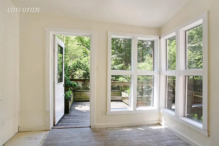 New York City Real Estate | View 34 King Street | Charming breakfast room leads to outdoor deck | View 6