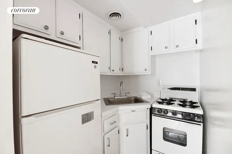 New York City Real Estate | View 160 East 26th Street, 3D | Updated white on white Kitchen. | View 3