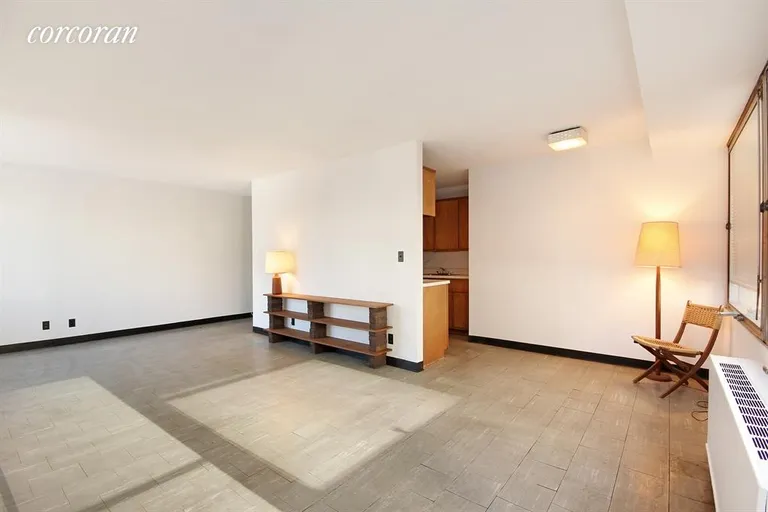 New York City Real Estate | View 180 Park Row, 5C | Living Room and Dining Area | View 2