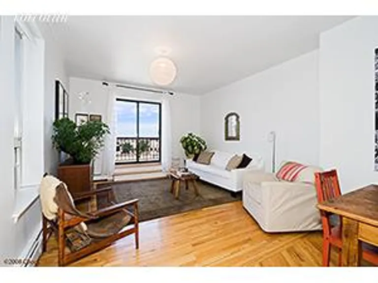 New York City Real Estate | View 115 Eastern Parkway, 6B | Living room with balcony | View 2