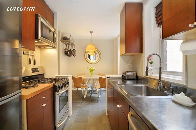 New York City Real Estate | View 101 West 23rd Street, 5H | Windowed kitchen with separate dining area | View 2