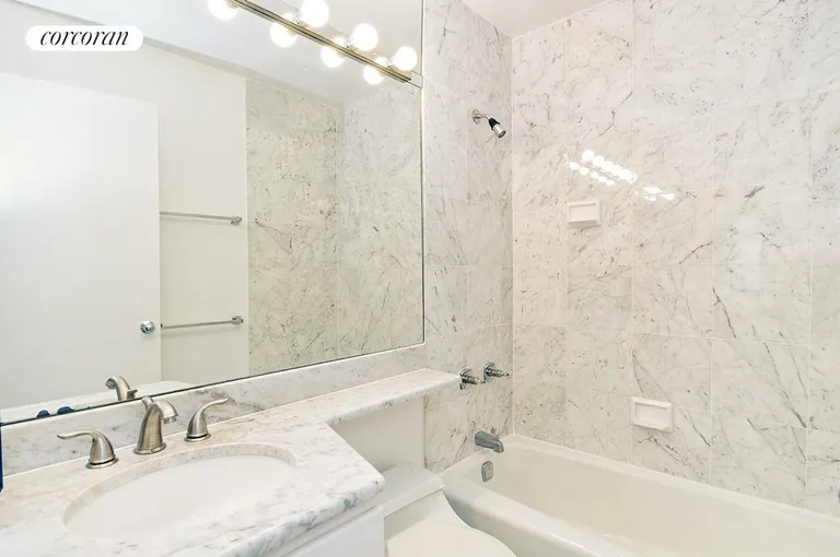 New York City Real Estate | View 45 East 25th Street, 21C | White marble bath | View 5