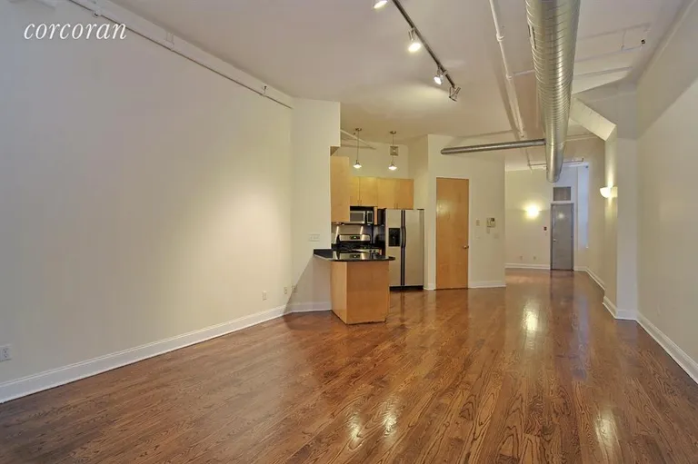 New York City Real Estate | View 176 Johnson Street, 7E | Open loft, looking from the bedroom to the entry | View 2