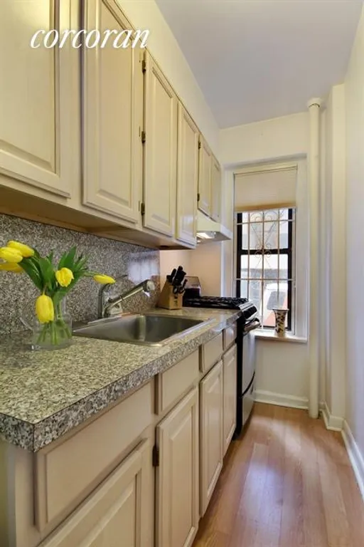 New York City Real Estate | View 225 West 25th Street, 1E | Windowed galley kitchen | View 2