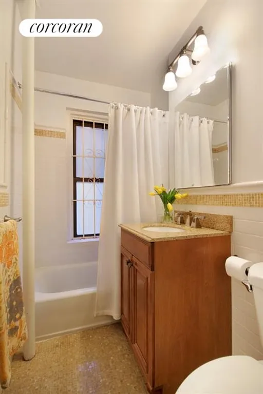 New York City Real Estate | View 225 West 25th Street, 1E | Windowed bathroom | View 5