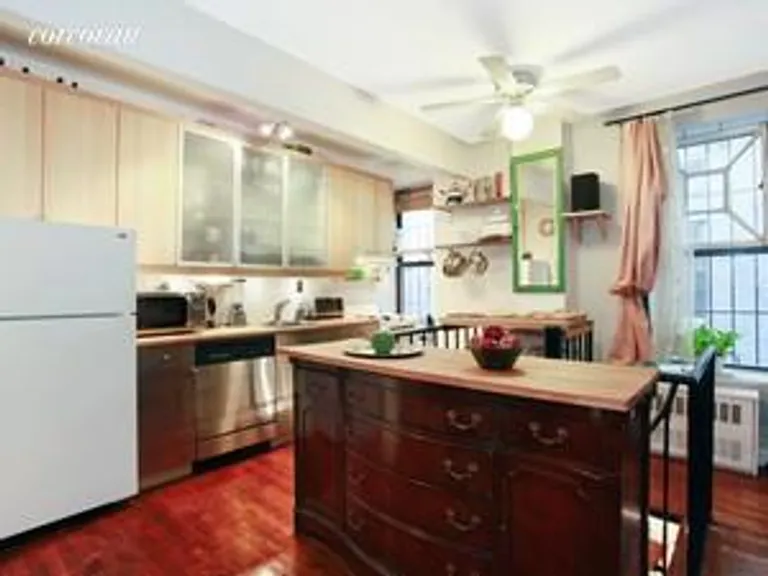 New York City Real Estate | View 409 Avenue C, 1B | Kitchen and spiral staircase | View 2