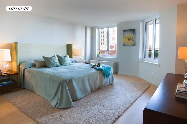 New York City Real Estate | View 333 Rector Place, 1008 | Spacious master bedroom measuring 15 x 13 with views of Rector Park, the Hudson River, and Ellis Island. | View 4