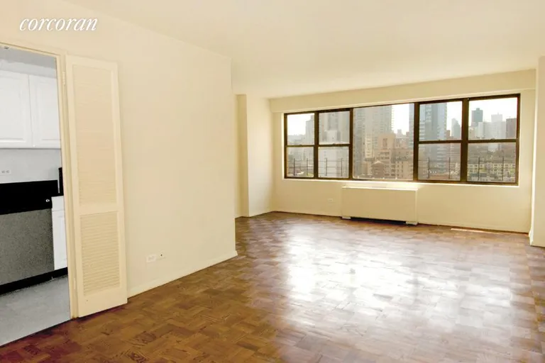 New York City Real Estate | View 230 East 79th Street, 17F | spacious living room  w/oak floors and central air | View 2