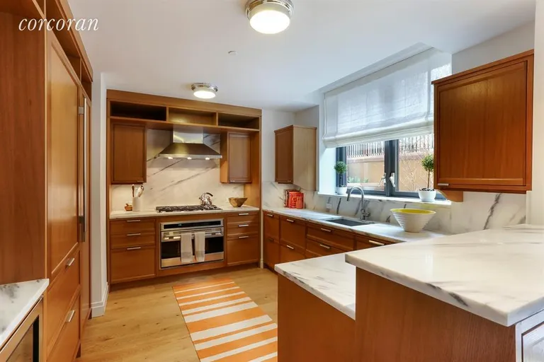 New York City Real Estate | View 455 West 20th Street, MEWS C | Windowed Kitchen w/ Oak Cabinets & Marble Counter | View 4