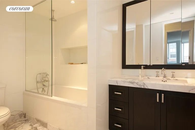 New York City Real Estate | View 333 Rector Place, 1203 | Second full bathroom featuring imported Italian marble | View 2
