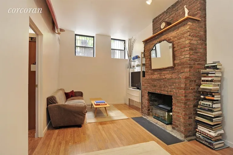New York City Real Estate | View 302 5th Avenue, 1R | 1 of 2 wood burnig fireplaces | View 4