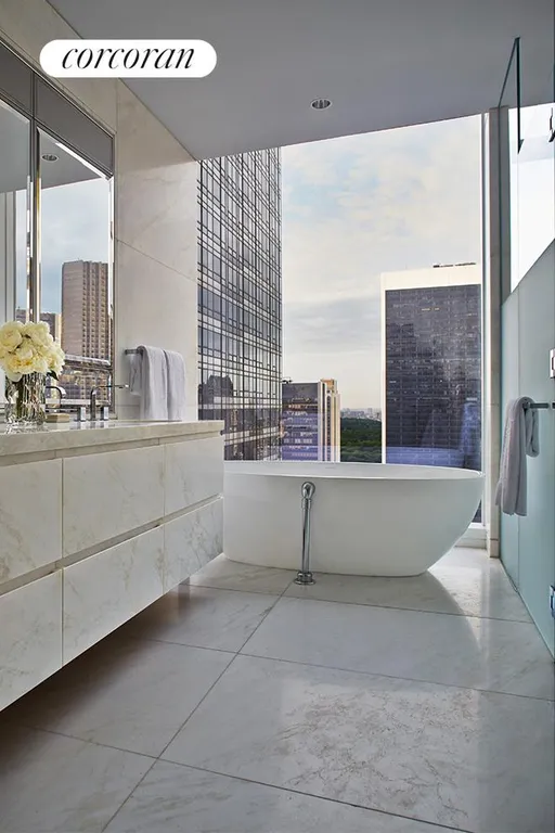 New York City Real Estate | View 20 West 53rd Street, 41A | Master bath with Lido white marble and soaking tub | View 5