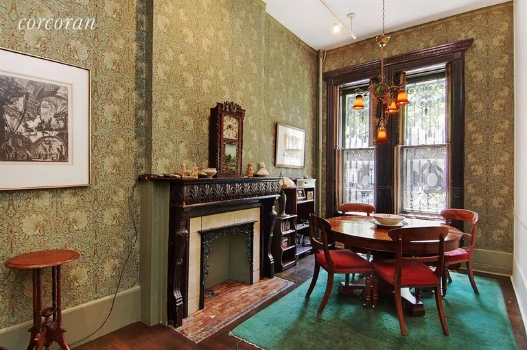 New York City Real Estate | View 163 West 88th Street | Elegant dining area complete with fireplace | View 4