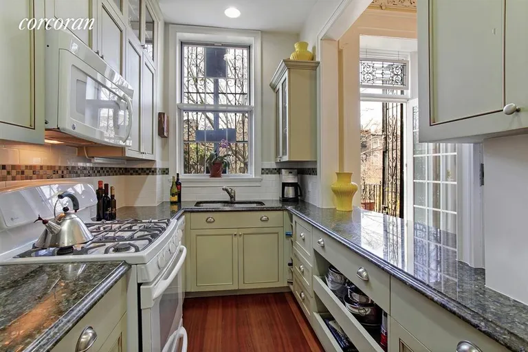 New York City Real Estate | View 166 Bergen Street | Windowed kitchen with custom cabinetry | View 3