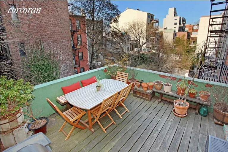 New York City Real Estate | View 494 State Street | Deck off the kitchen with garden views | View 4