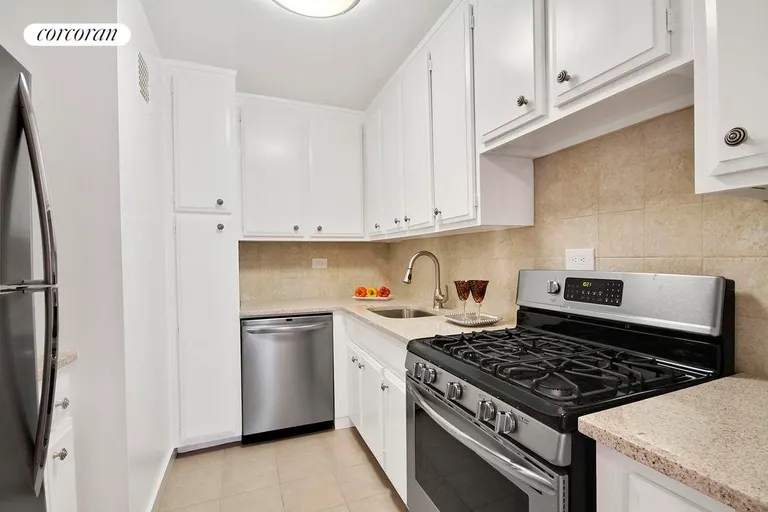 New York City Real Estate | View 77 East 12th Street, 18A | Kitchen with granite and stainlees steeel applianc | View 5