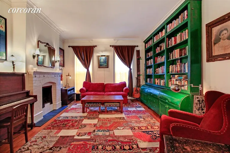 New York City Real Estate | View 353 West 21st Street | South facing living room with fireplace | View 2