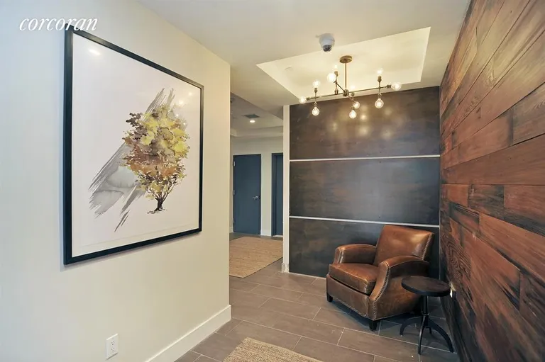 New York City Real Estate | View 102 Gold Street, 3F | a welcoming wood-panelled lobby | View 5