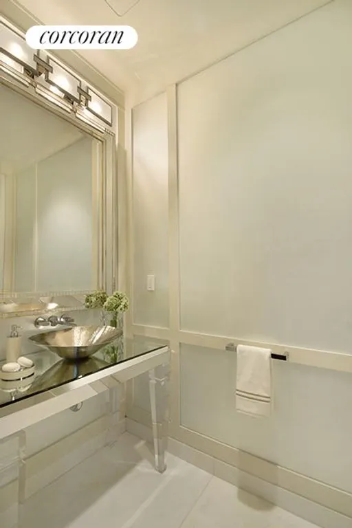 New York City Real Estate | View 20 West 53rd Street, 35A | Powder room with frosted, mirrored glass-panels | View 7