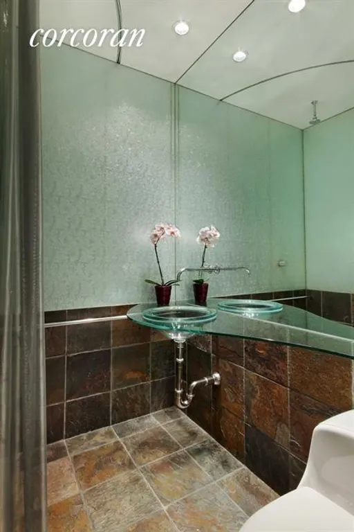 New York City Real Estate | View 164 East 83rd Street | Stunning Bathroom with Luminescent Glass Walls | View 5