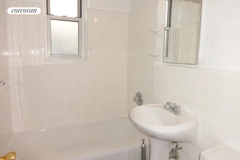 New York City Real Estate | View 2107 Wallace Avenue, 6B | White Tile Bathroom with window | View 12