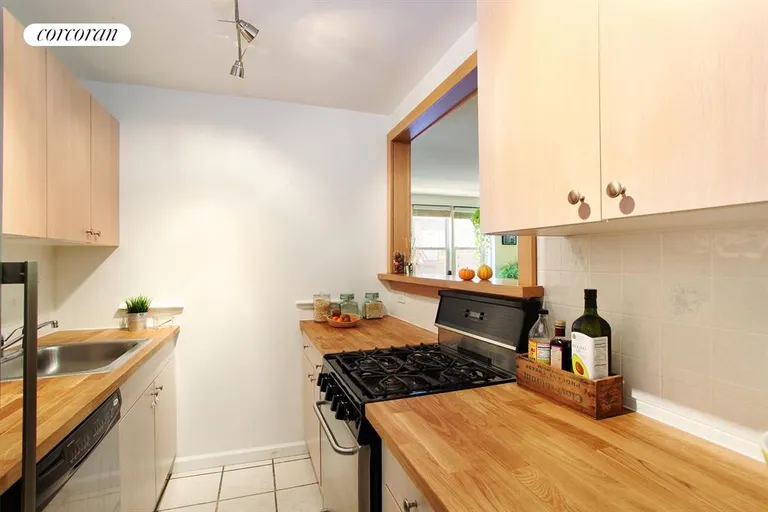 New York City Real Estate | View 400 East 17th Street, 512 | Open and airy kitchen with passthrough | View 2