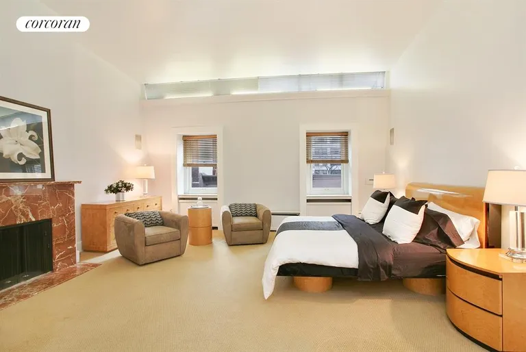 New York City Real Estate | View 406 East 50th Street | Master Bedroom with Skylight and WBFPL | View 5