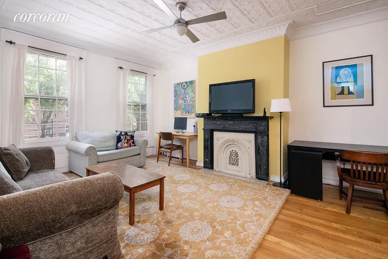 New York City Real Estate | View 336 Sackett Street | Original tin ceilings and moldings in front parlor | View 2