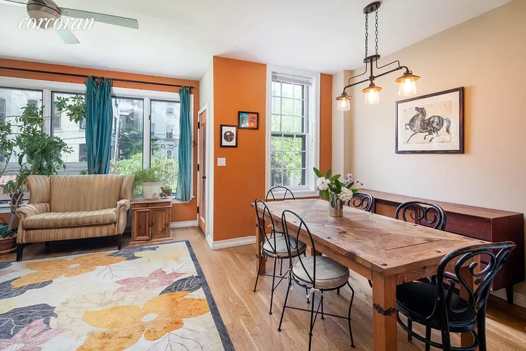 New York City Real Estate | View 336 Sackett Street | Dining area and den overlooking garden | View 4