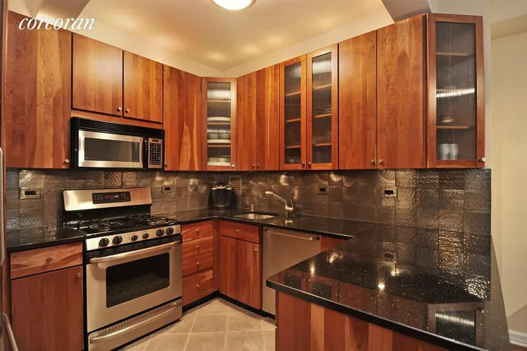 New York City Real Estate | View 301 East 48th Street, 15K | Renovated Kitchen with Stainless Appliances | View 2